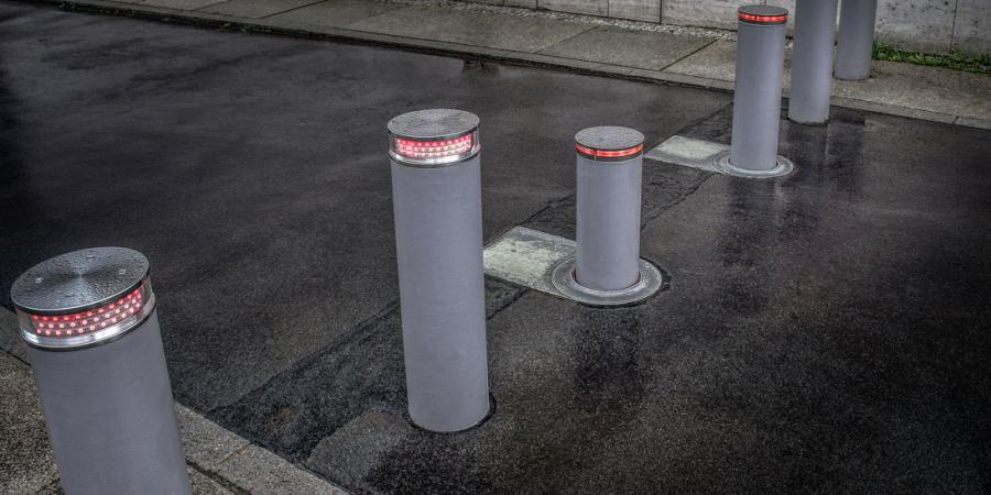 grey automatic bollards on the street